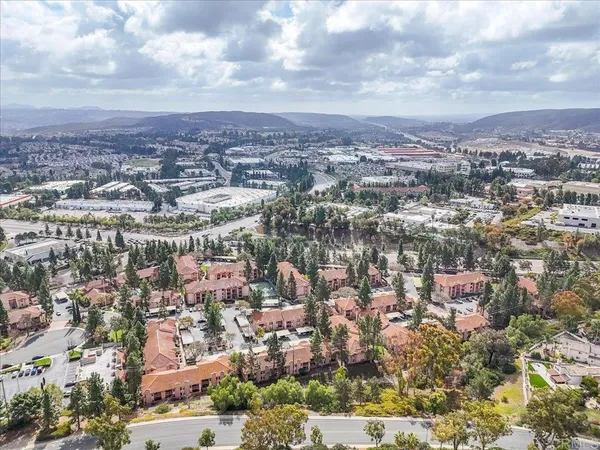 an aerial view of a city with lots of residential buildings
