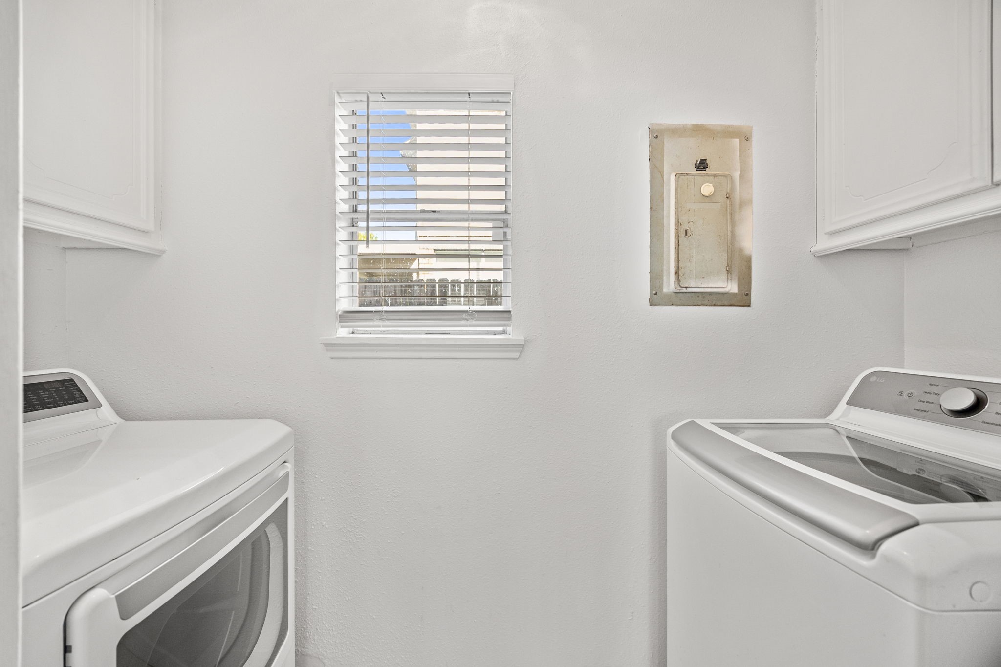 8043 Oceanside Drive Houston, TX 77095 - Photo 17 of 41 a utility room with dryer and washer