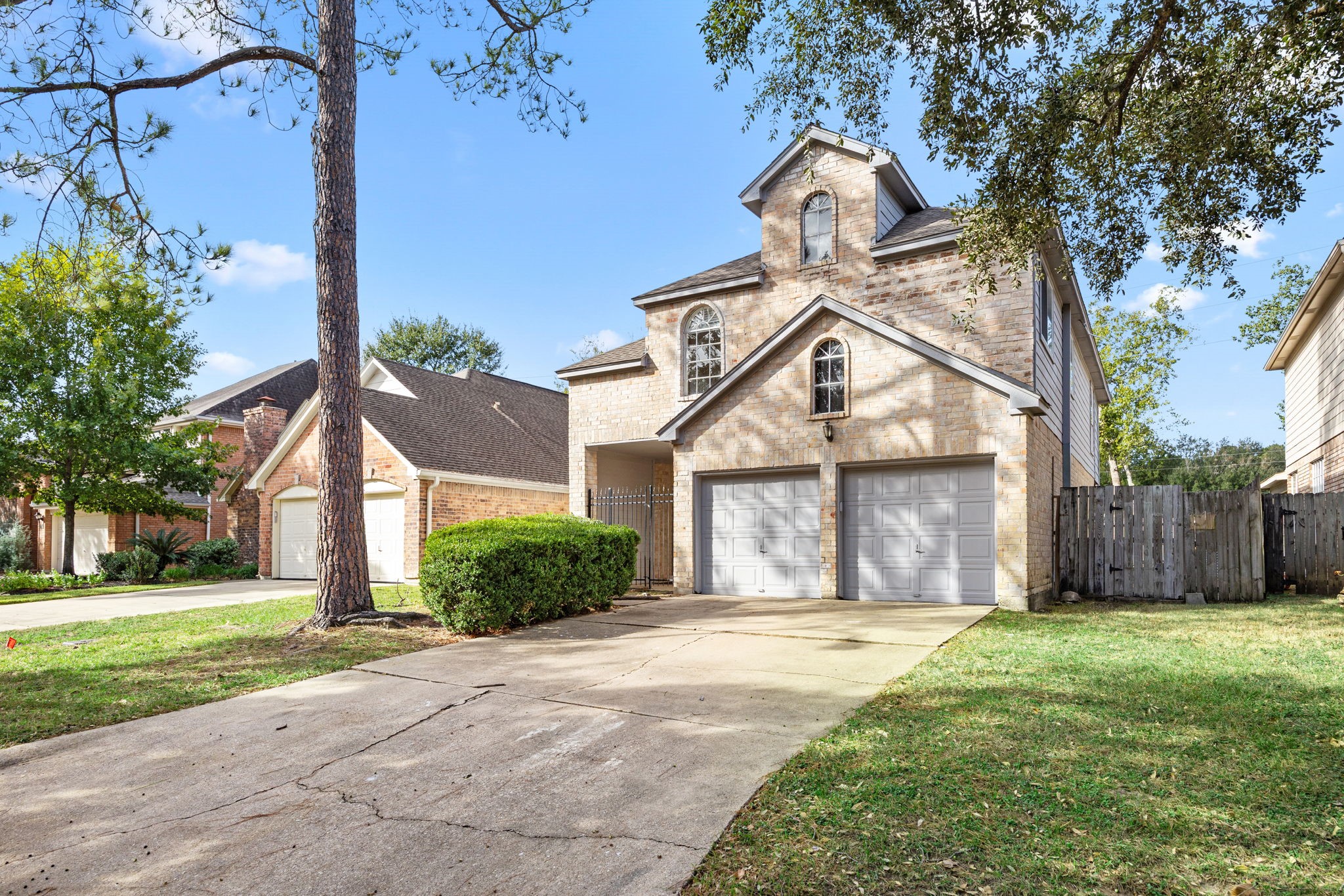 8043 Oceanside Drive Houston, TX 77095 - Photo 2 of 41 a front view of a house with garden and plants