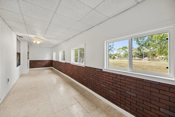 a view of hallway with a large window