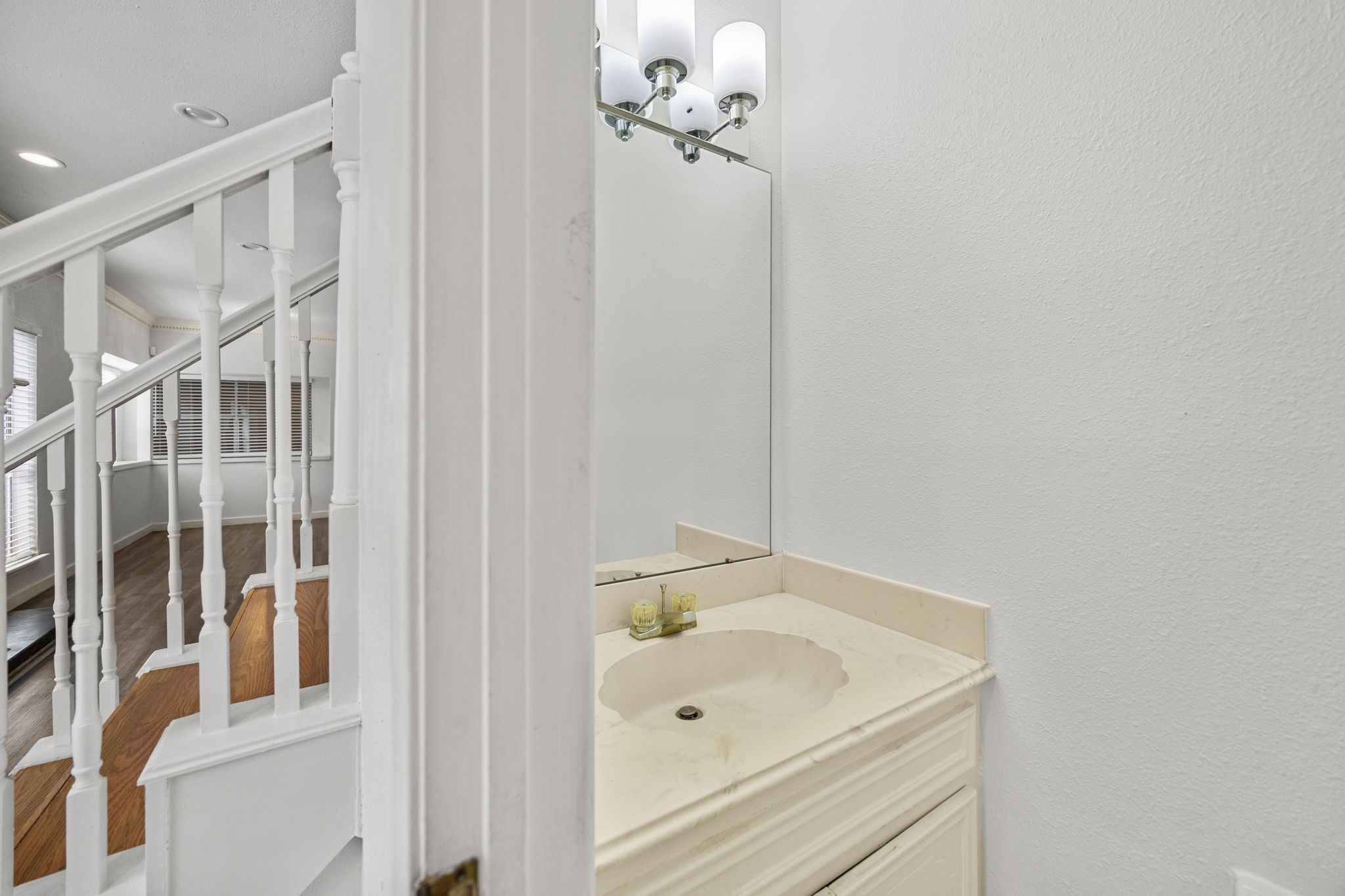 8043 Oceanside Drive Houston, TX 77095 - Photo 28 of 41 a bathroom with a sink and a mirror