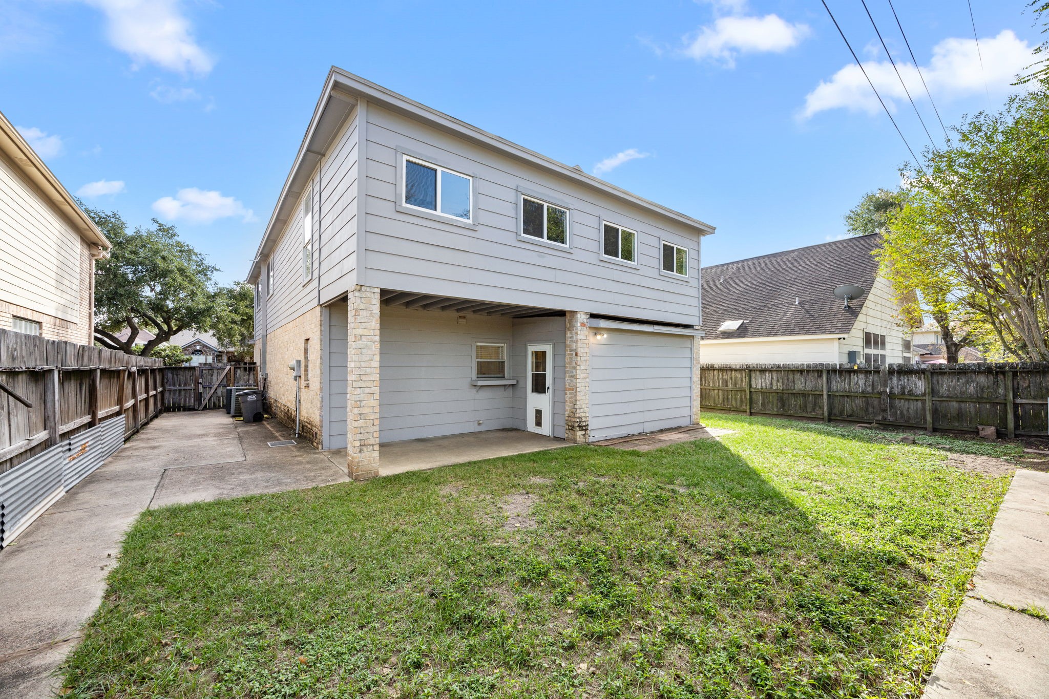8043 Oceanside Drive Houston, TX 77095 - Photo 30 of 41 a front view of a house with a yard and garage
