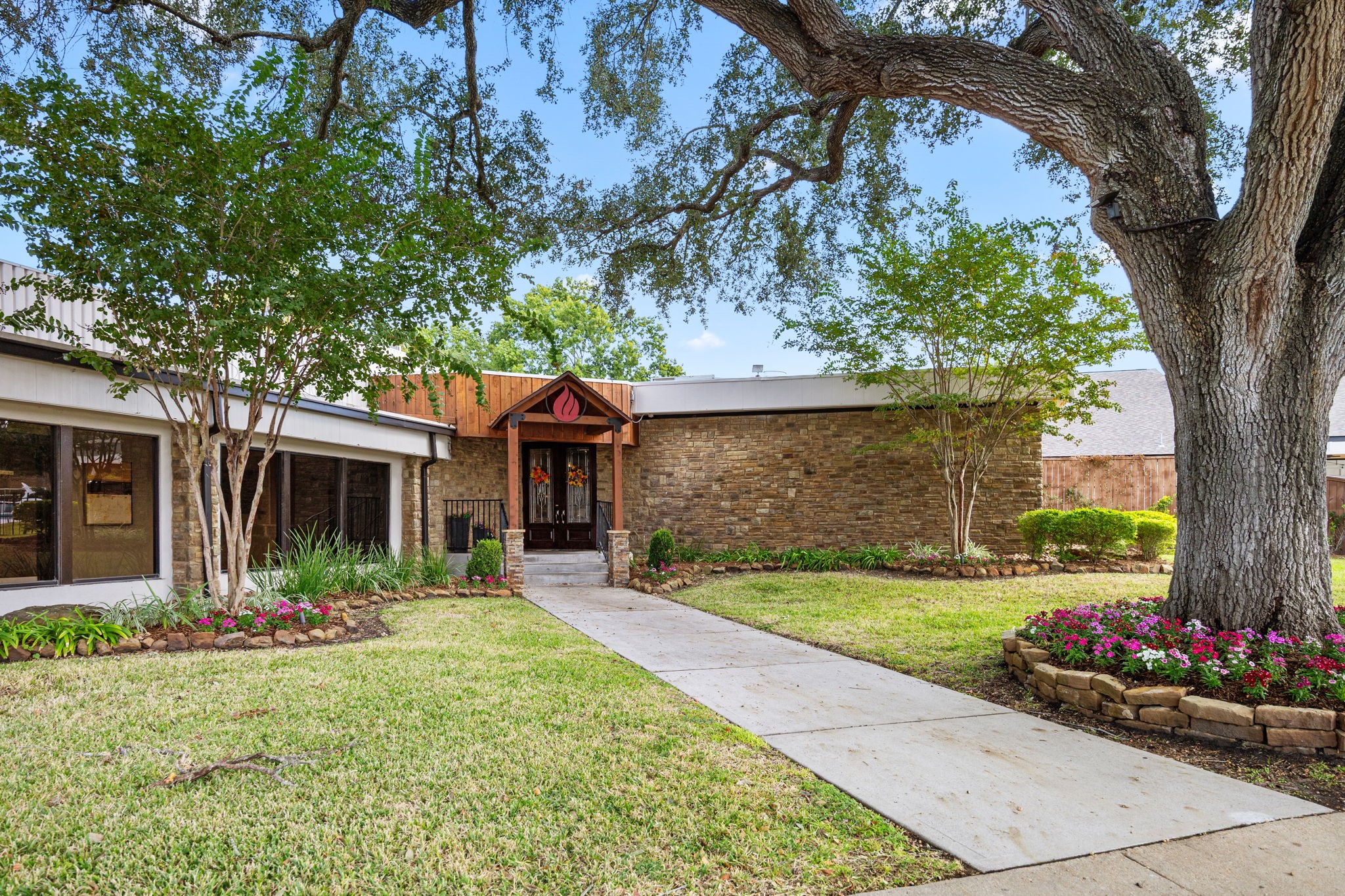 8043 Oceanside Drive Houston, TX 77095 - Photo 38 of 41 a front view of a house with garden