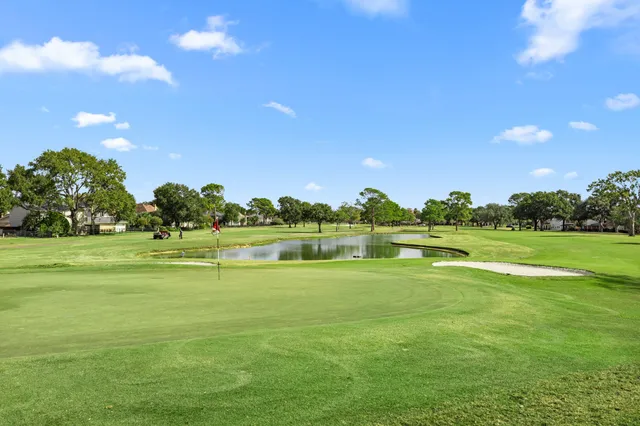 a view of a lake with houses in the background