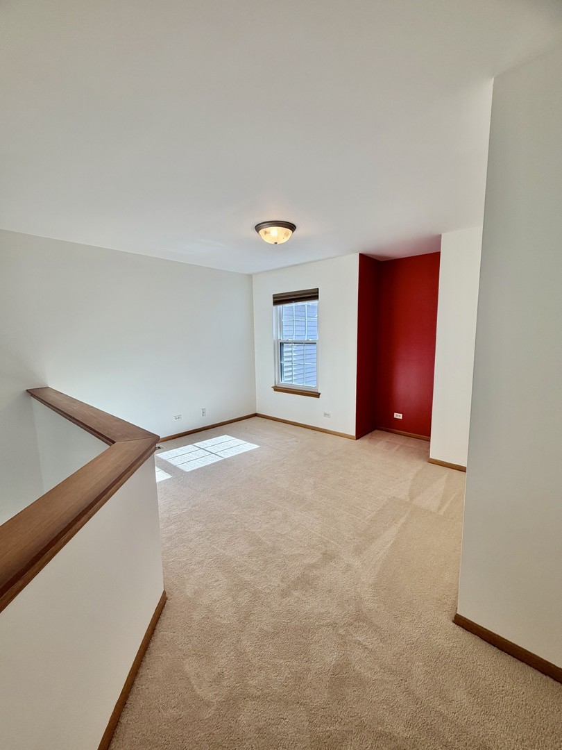 4 Haverton Court Streamwood, IL 60107 - Photo 13 of 30 a view of an empty room and window