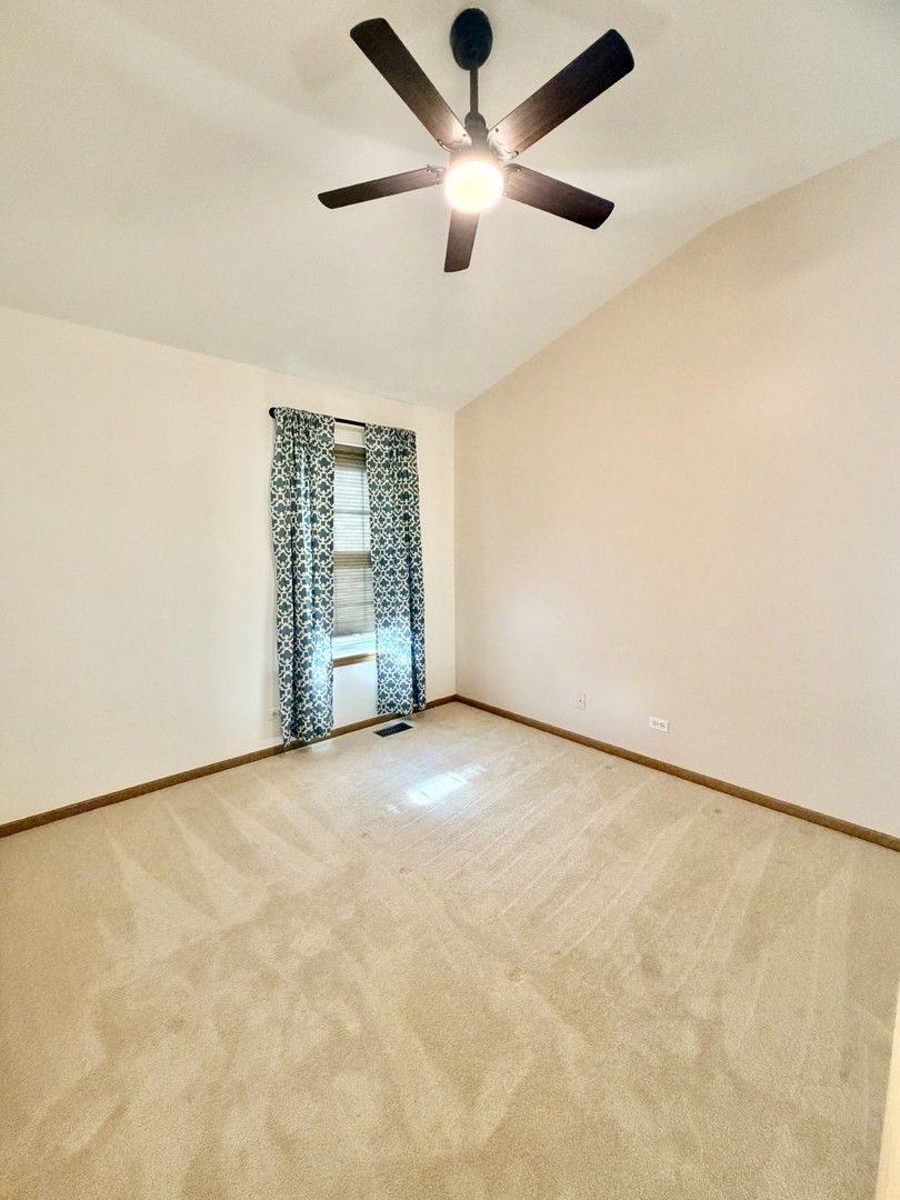 4 Haverton Court Streamwood, IL 60107 - Photo 18 of 30 an empty room with windows and fan