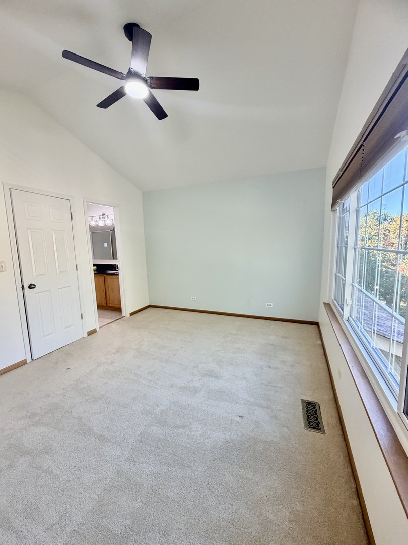 4 Haverton Court Streamwood, IL 60107 - Photo 20 of 30 an empty room with a empty space and a ceiling fan