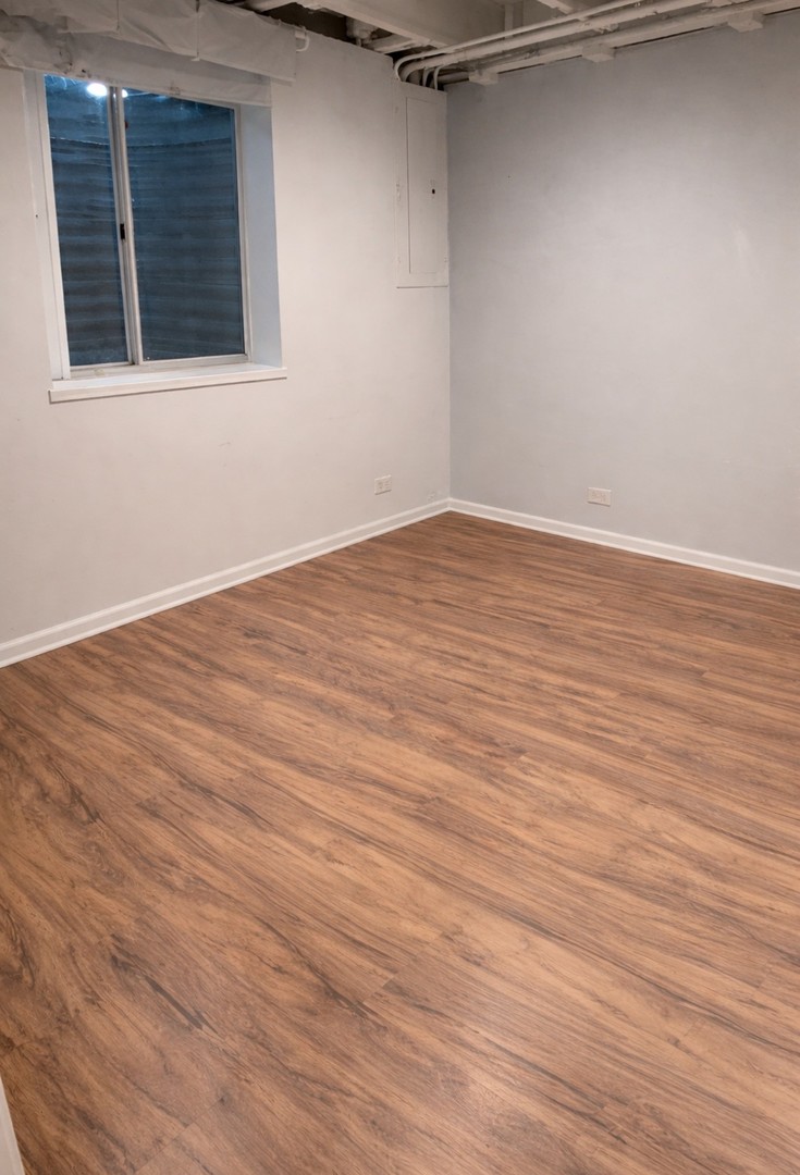 4 Haverton Court Streamwood, IL 60107 - Photo 27 of 30 an empty room with wooden floor and windows