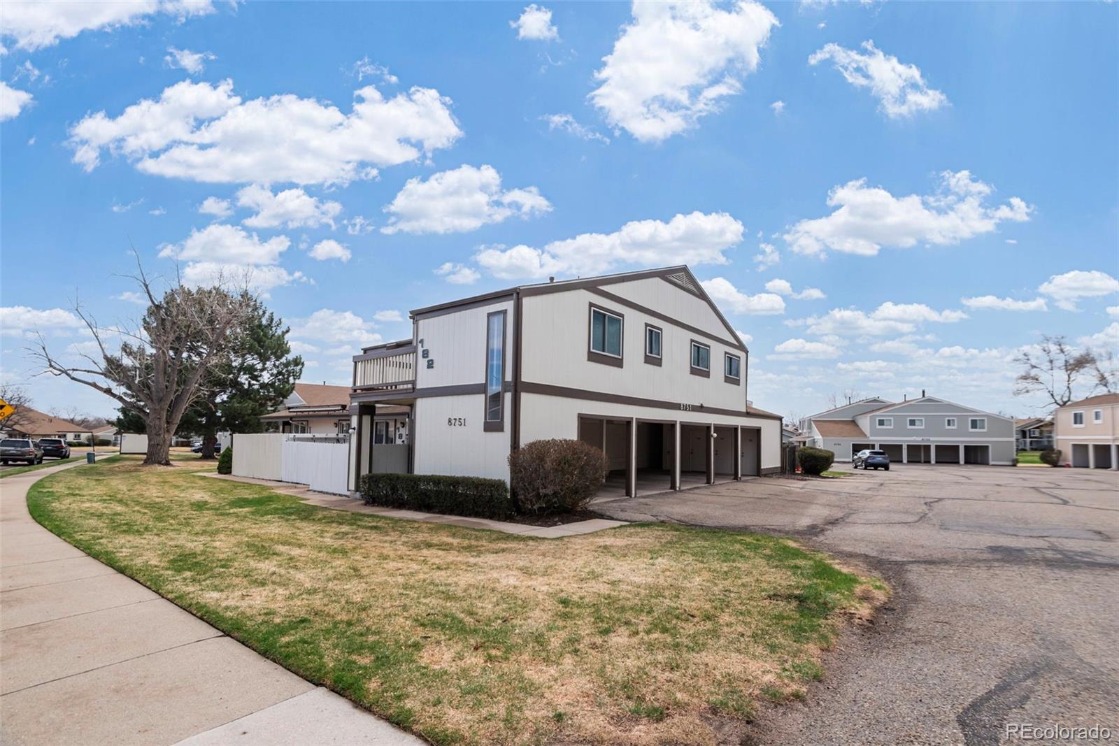 8751 Chase Drive, Unit 181 Arvada, CO 80003 - Photo 23 of 25 a view of a house with a yard
