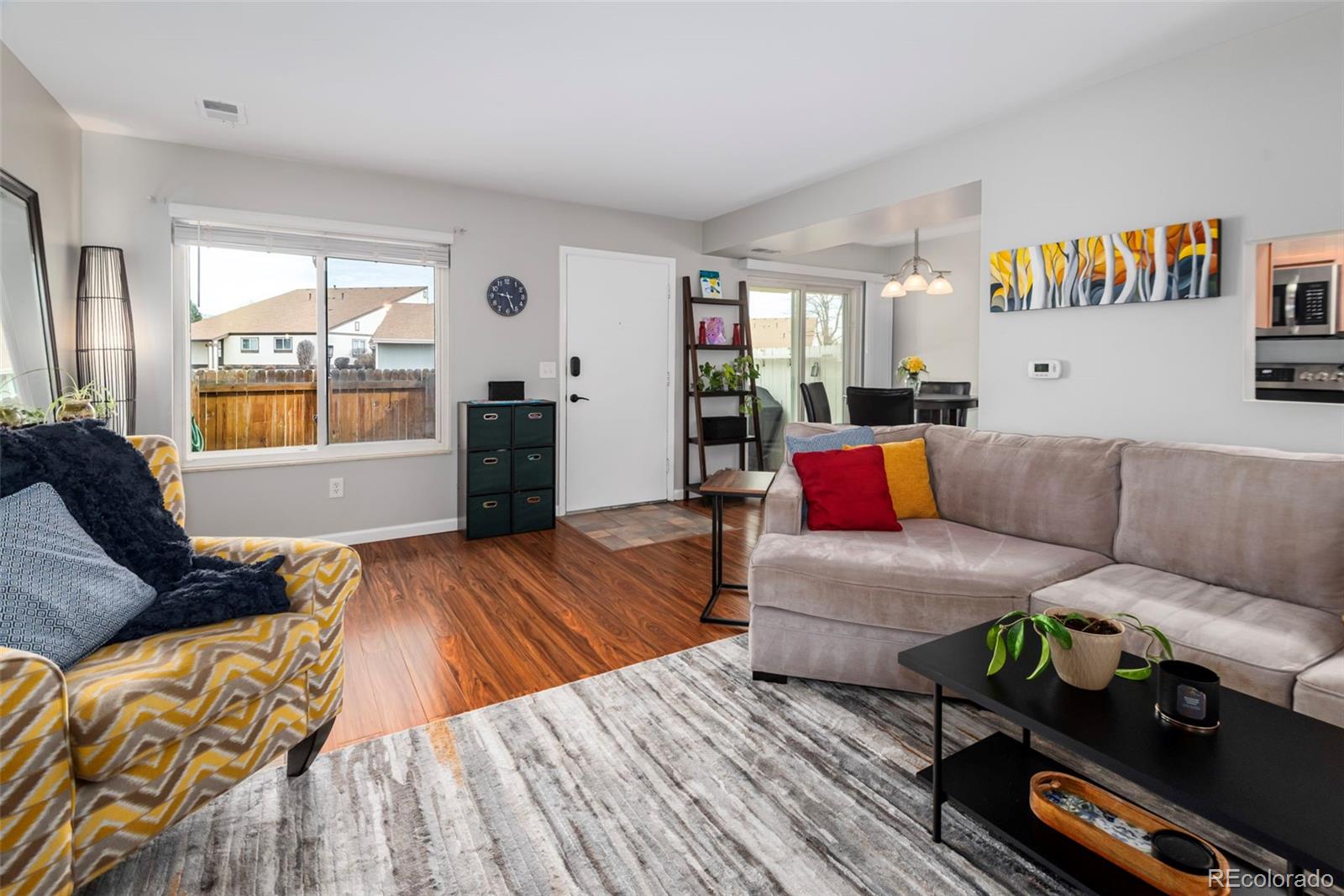 8751 Chase Drive, Unit 181 Arvada, CO 80003 - Photo 4 of 25 a living room with furniture and a large window