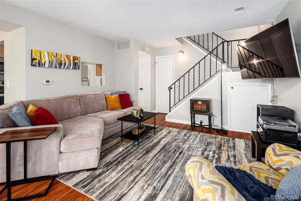 a living room with furniture and a flat screen tv