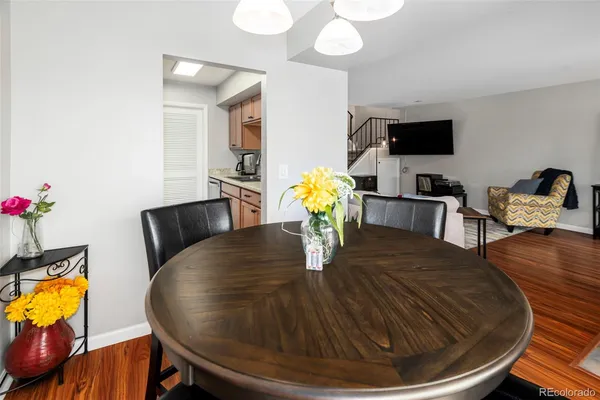a view of a dining room with furniture and wooden floor