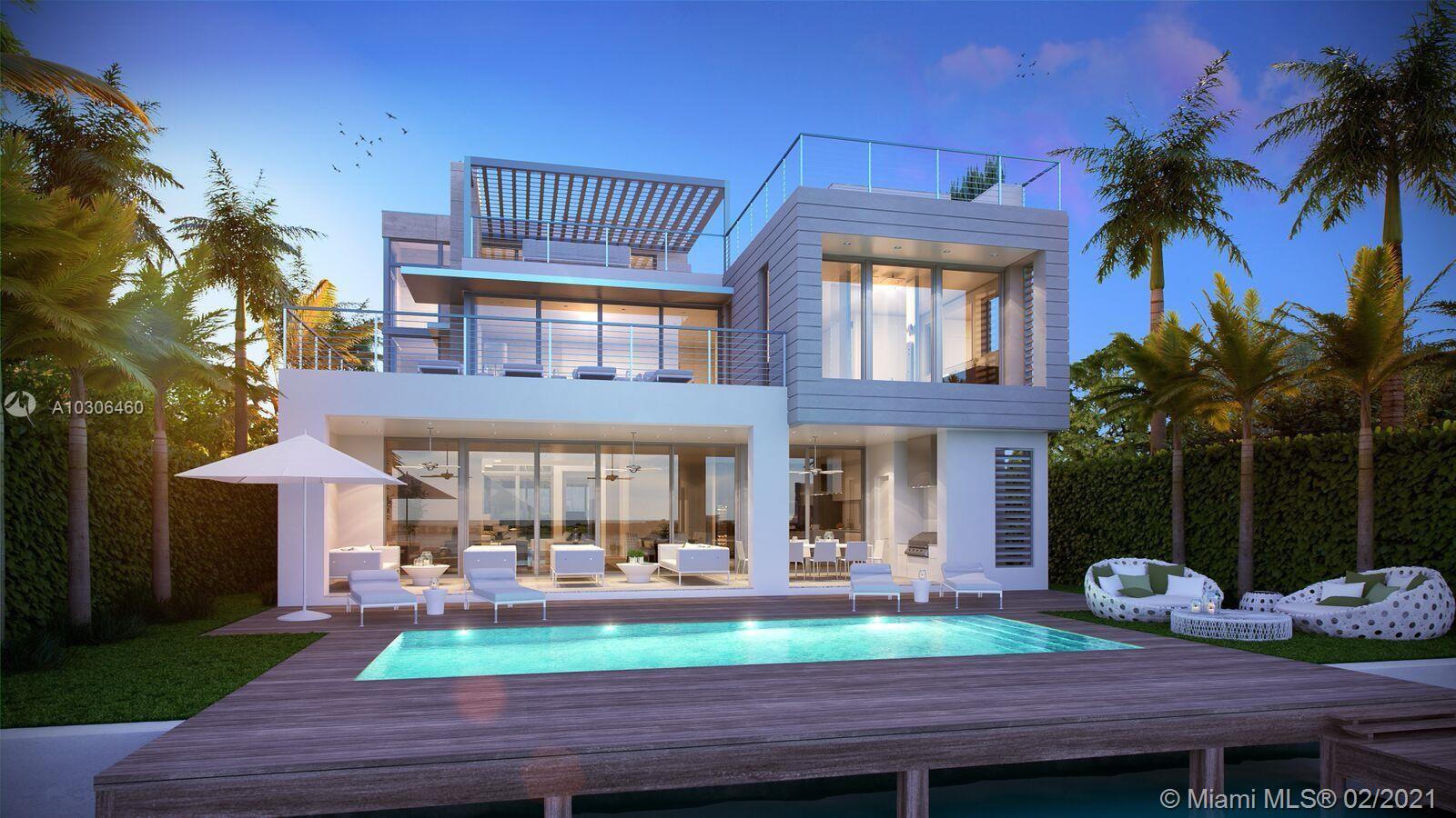 1045 North Venetian Drive Miami Beach, FL 33139 - Photo 1 of 13 a front view of a house with garden and patio
