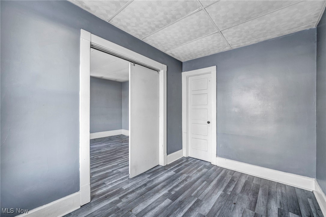 3405 Roehl Avenue Cleveland, OH 44109 - Photo 31 of 50 Spare room with baseboards and dark wood finished floors