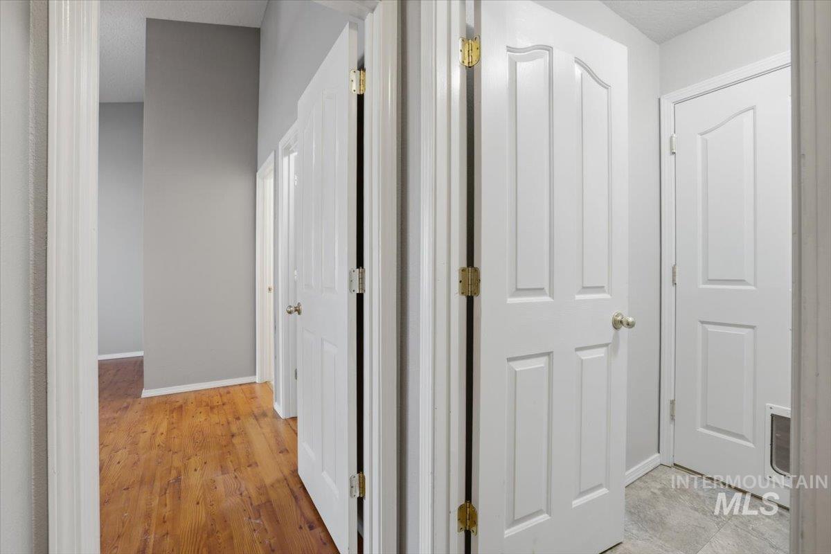 3273 North Chatterton Way Boise, ID 83713 - Photo 14 of 29 Corridor featuring light wood-style floors and baseboards