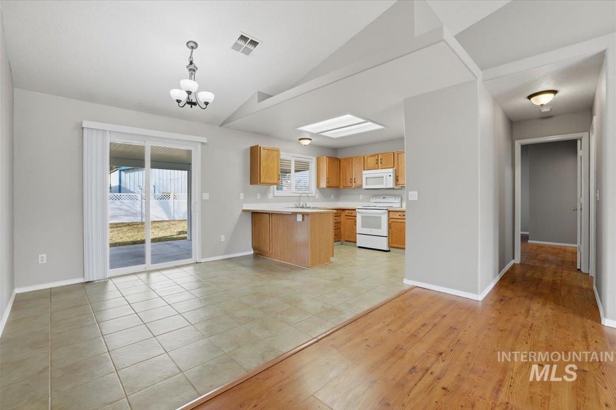 3273 North Chatterton Way Boise, ID 83713 - Photo 8 of 29 Dining area with sliding glass door leading to back covered patio.