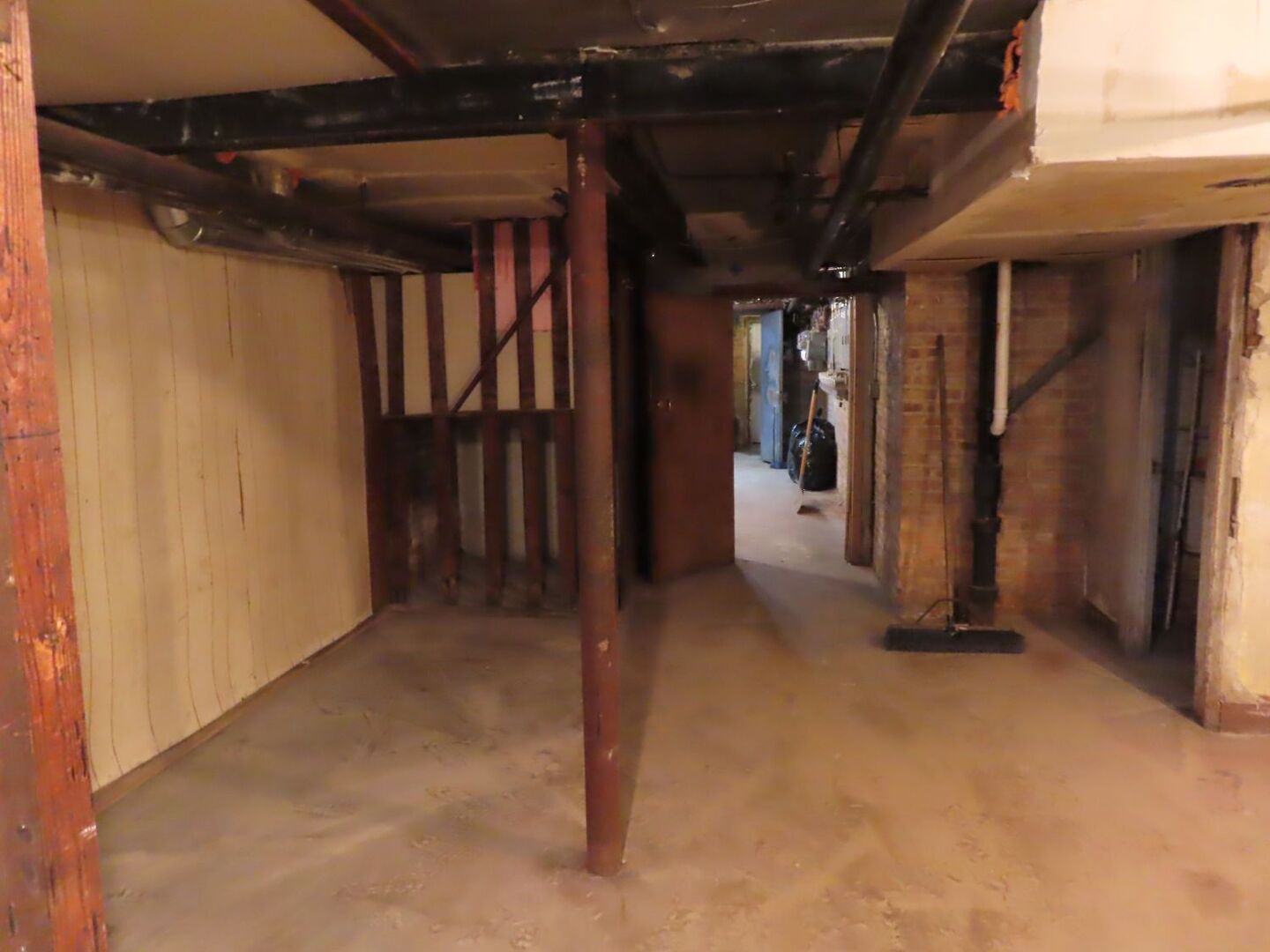 7918 South Calumet Avenue Chicago, IL 60619 - Photo 7 of 8 a view of a hallway with wooden shelves