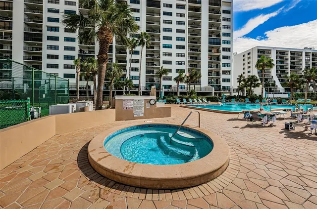 a view of a swimming pool with a lounge chair