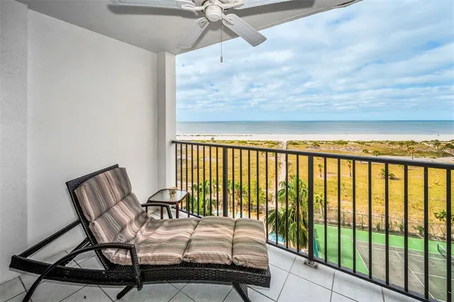 a view of a balcony with furniture