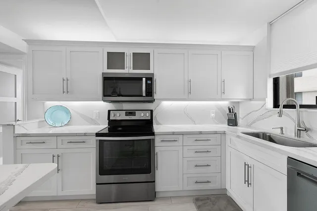 a bathroom with a granite countertop sink mirror and double