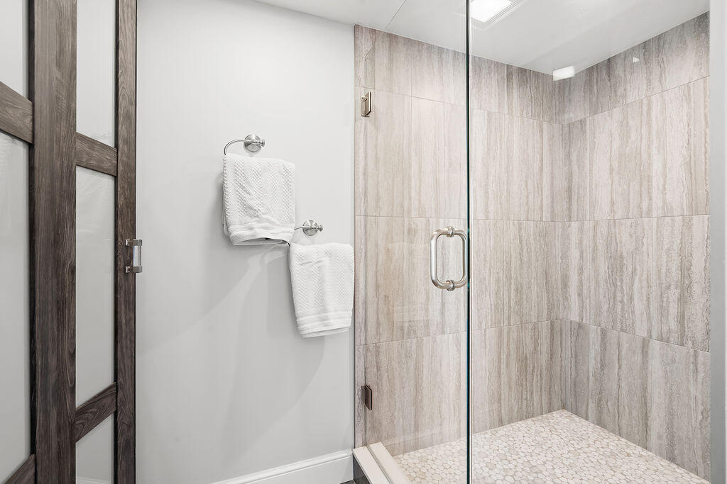 300 Ocean Trail Way, Unit 301 Jupiter, FL 33477 - Photo 25 of 64 a bathroom with a shower