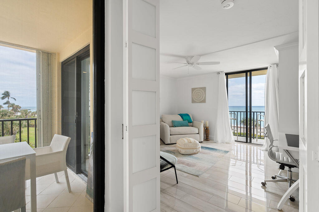300 Ocean Trail Way, Unit 301 Jupiter, FL 33477 - Photo 27 of 64 a living room with furniture and a window