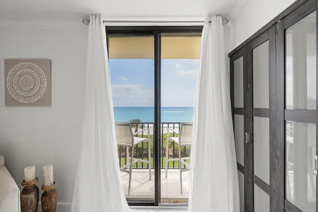 a view of a field with an ocean