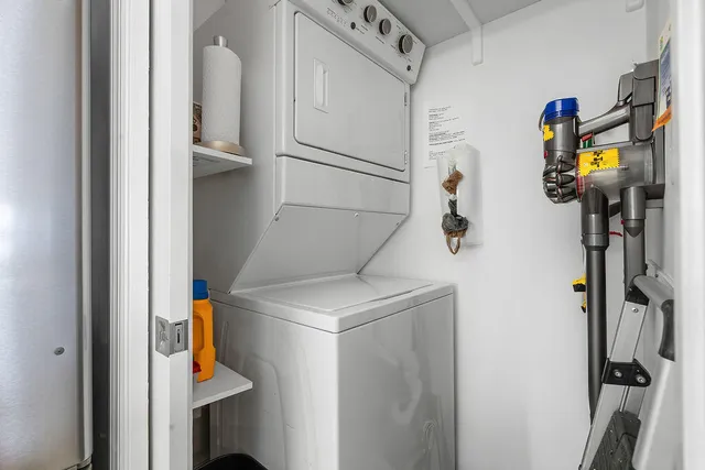a view of a big room with a lawn chairs and a table