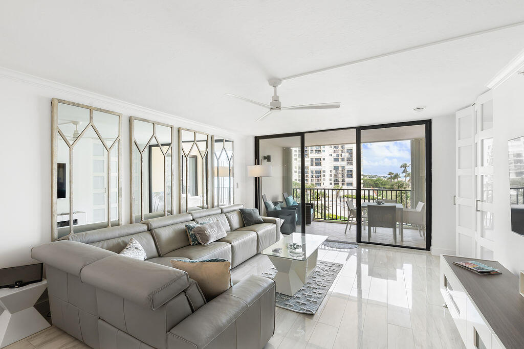 300 Ocean Trail Way, Unit 301 Jupiter, FL 33477 - Photo 6 of 64 a living room with furniture and a large window