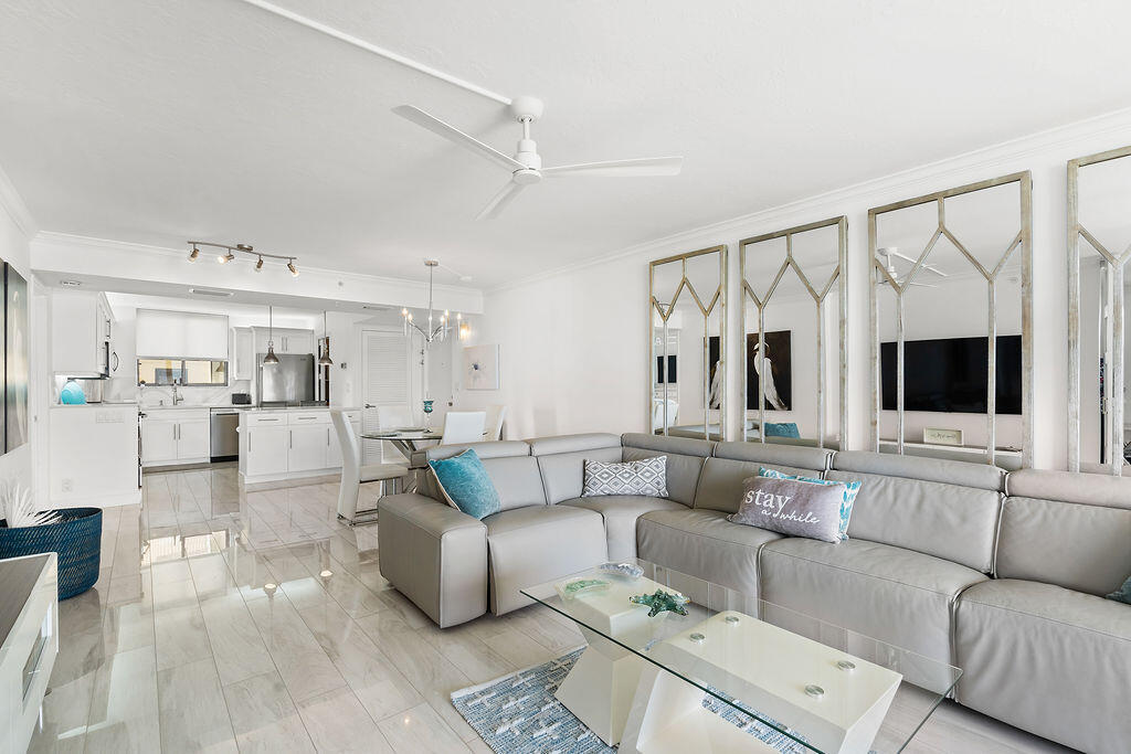 300 Ocean Trail Way, Unit 301 Jupiter, FL 33477 - Photo 7 of 64 a living room with furniture and a flat screen tv