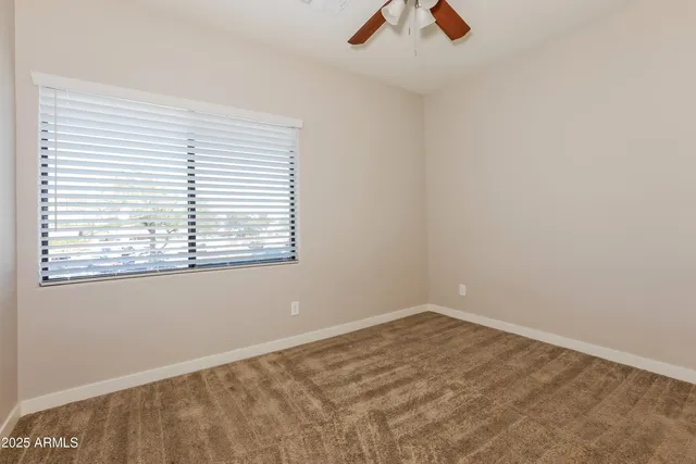 an empty room with fan