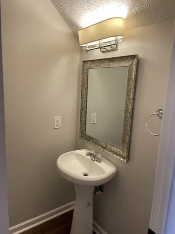 a bathroom with a sink and mirror