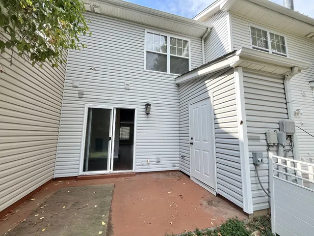 a view of a white house with a white door
