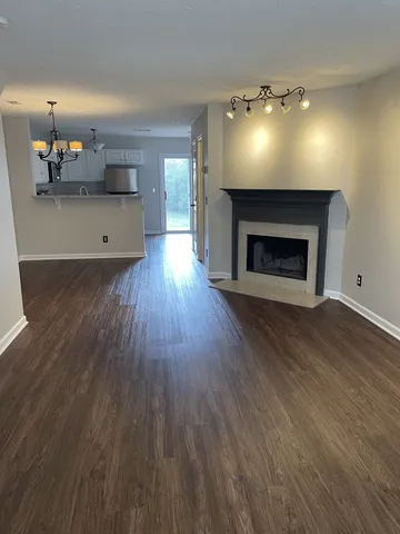 a view of a room with a fireplace wooden floor and fire place