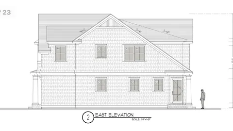 a view of a house with white walls