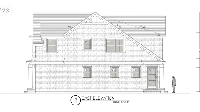 a view of a house with white walls