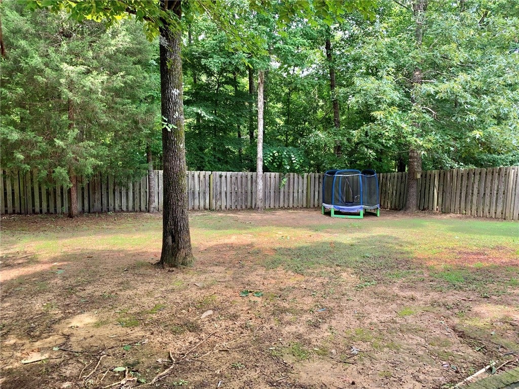 1756 Vfw Road Auburn, AL 36830 - Photo 23 of 26 The shaded yard is flat and fully fenced.