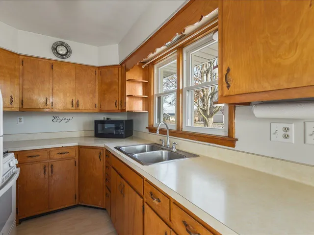 a kitchen with a sink and a window