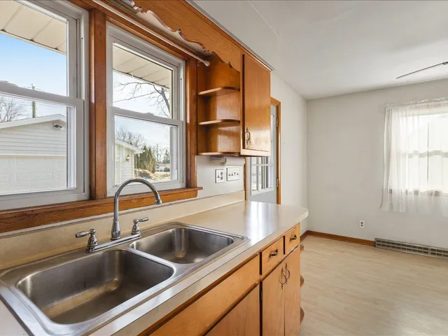 a kitchen with a sink and a window