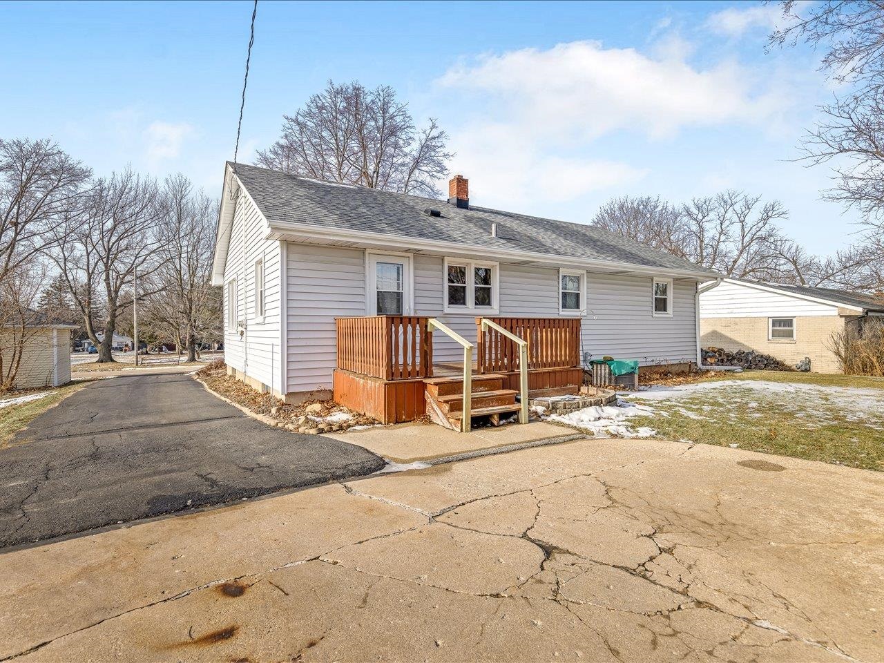205 North Seward Street Winnebago, IL 61088 - Photo 2 of 4 a view of a house with snow on the road
