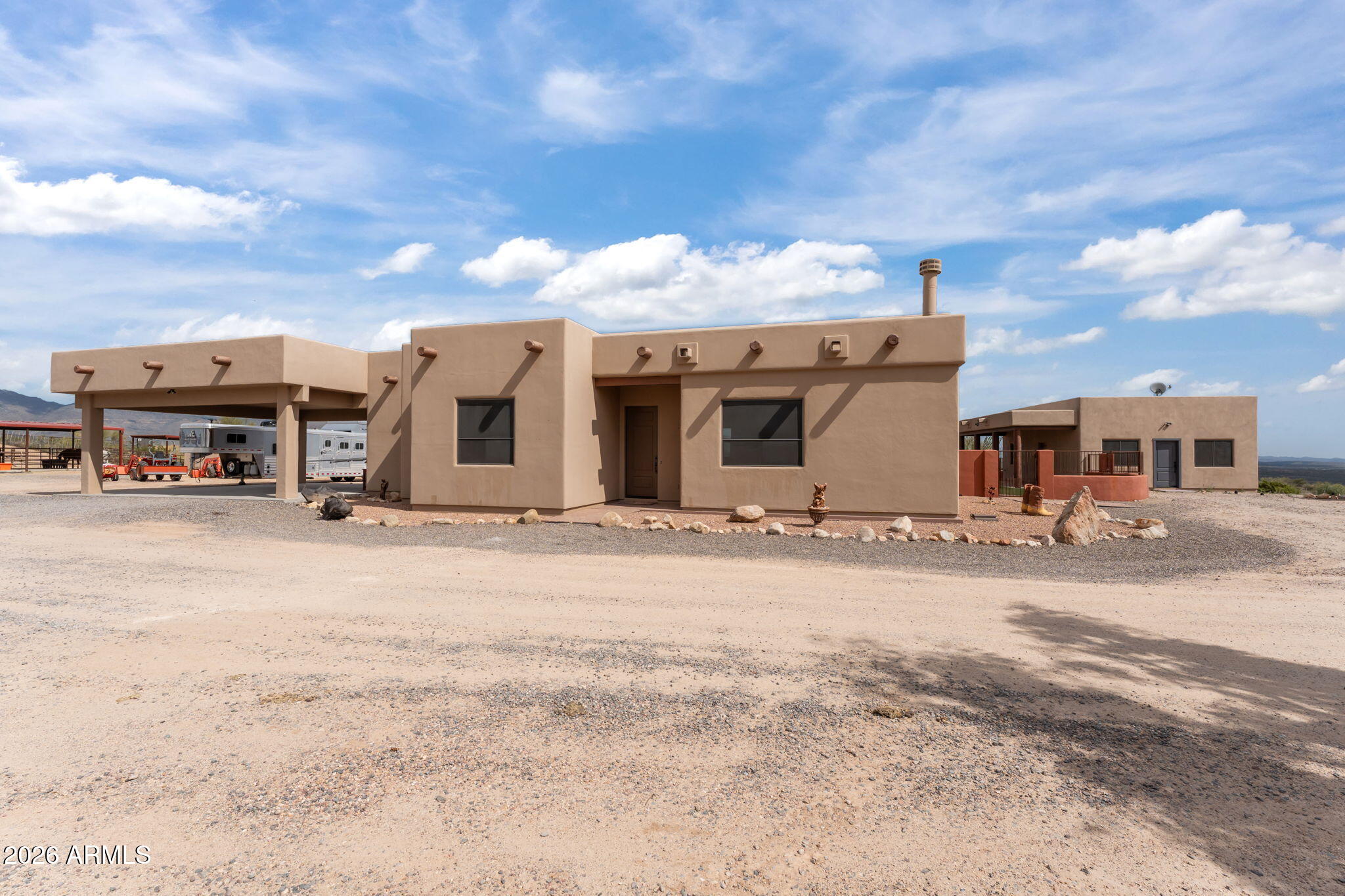 21800 West Hawkeye Road Congress, AZ 85332 - Photo 23 of 61 a front view of a house with a yard and garage