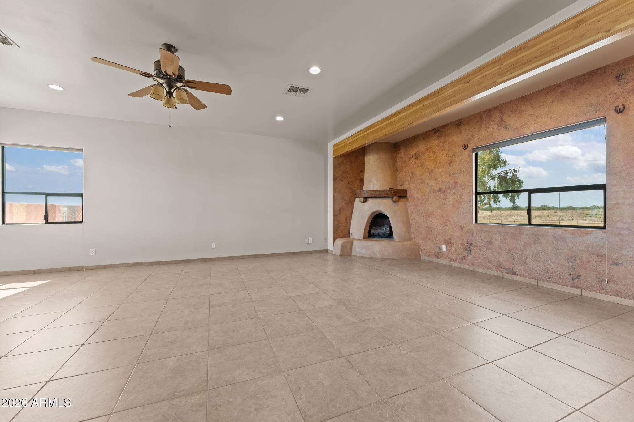 21800 West Hawkeye Road Congress, AZ 85332 - Photo 35 of 61 a view of a livingroom with a ceiling fan and window