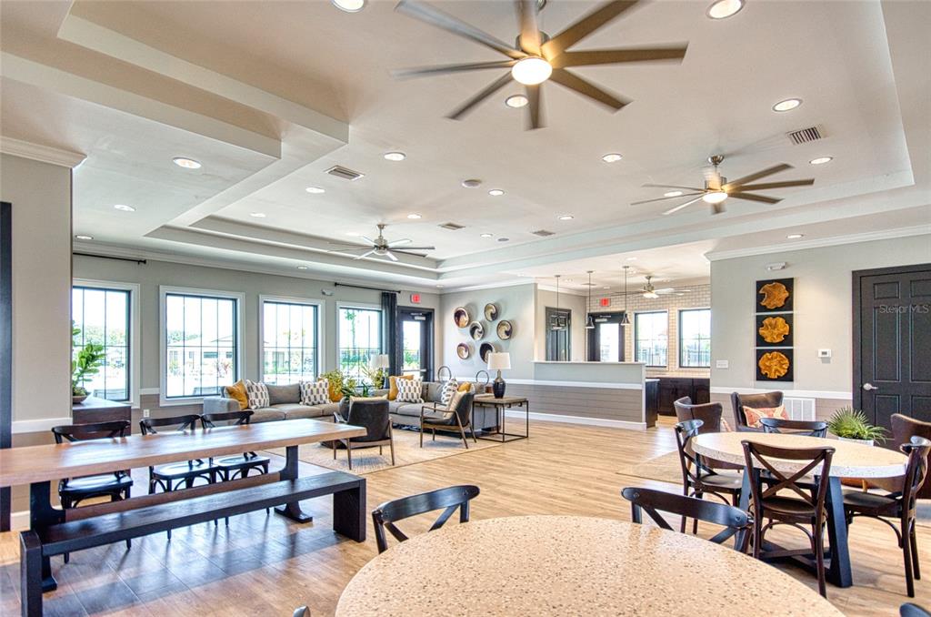 6736 Ripple Pond Loop Zephyrhills, FL 33541 - Photo 29 of 40 a living room with lots of furniture and a large window
