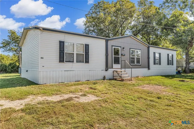 a house with yard in front of it