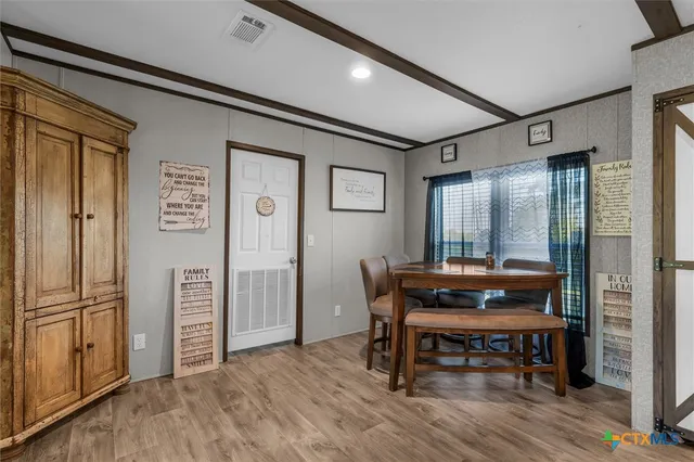 a view of a livingroom with furniture and wooden floor