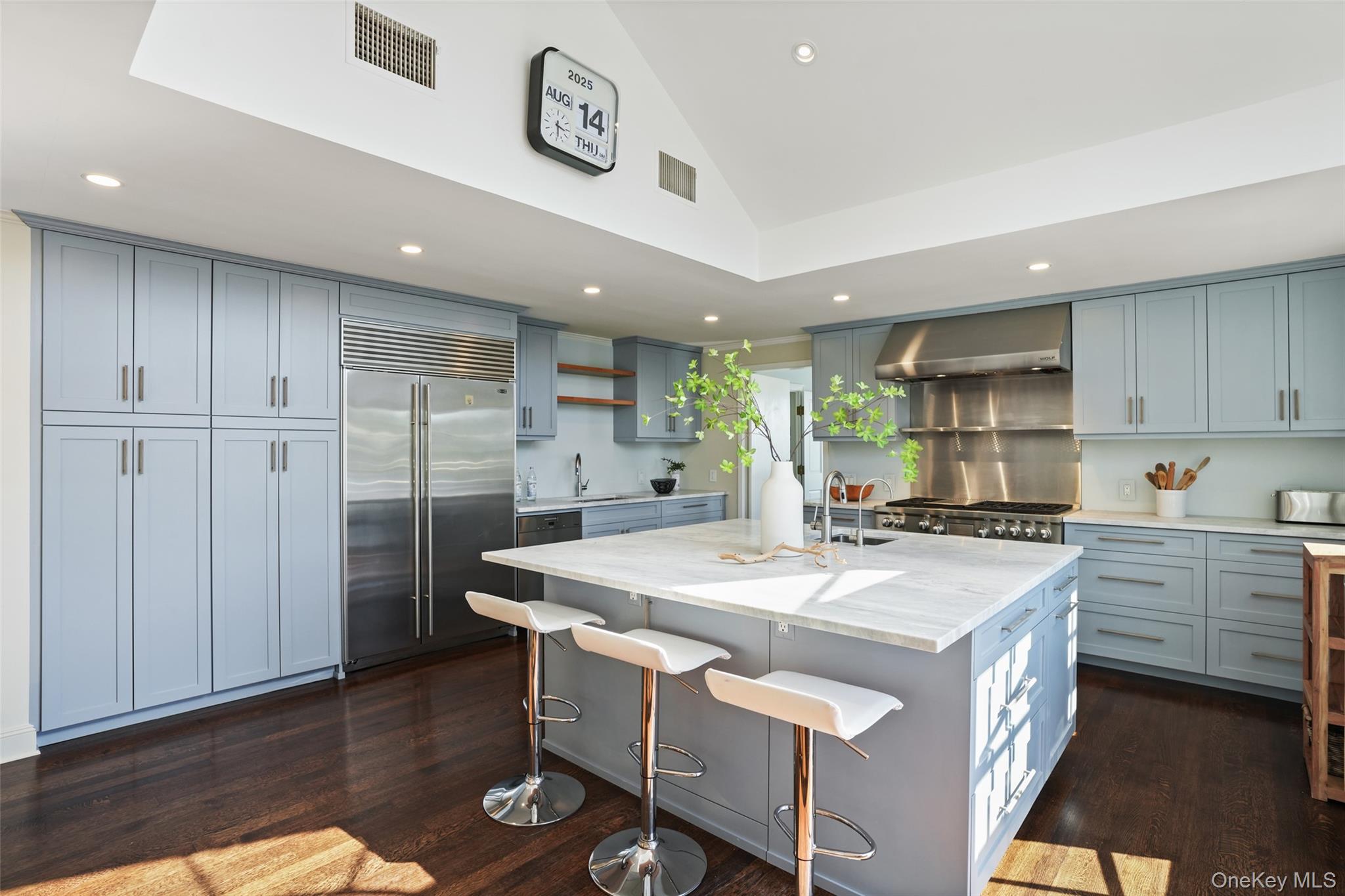 6 Pine Island Road Rye, NY 10580 - Photo 5 of 38 a kitchen with a stove a refrigerator a sink and a microwave