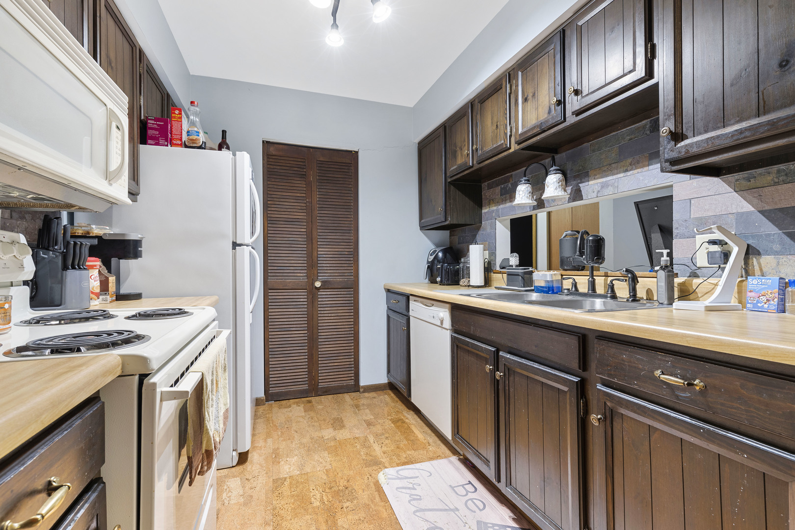 1723 Cedarbrook Court Sycamore, IL 60178 - Photo 2 of 11 a kitchen with stainless steel appliances granite countertop a refrigerator and a stove