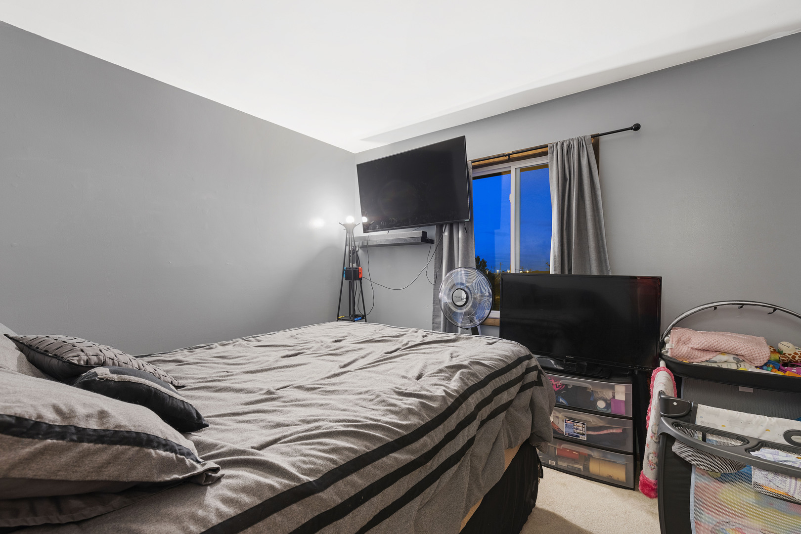 1723 Cedarbrook Court Sycamore, IL 60178 - Photo 5 of 11 a bedroom with a bed and a tv