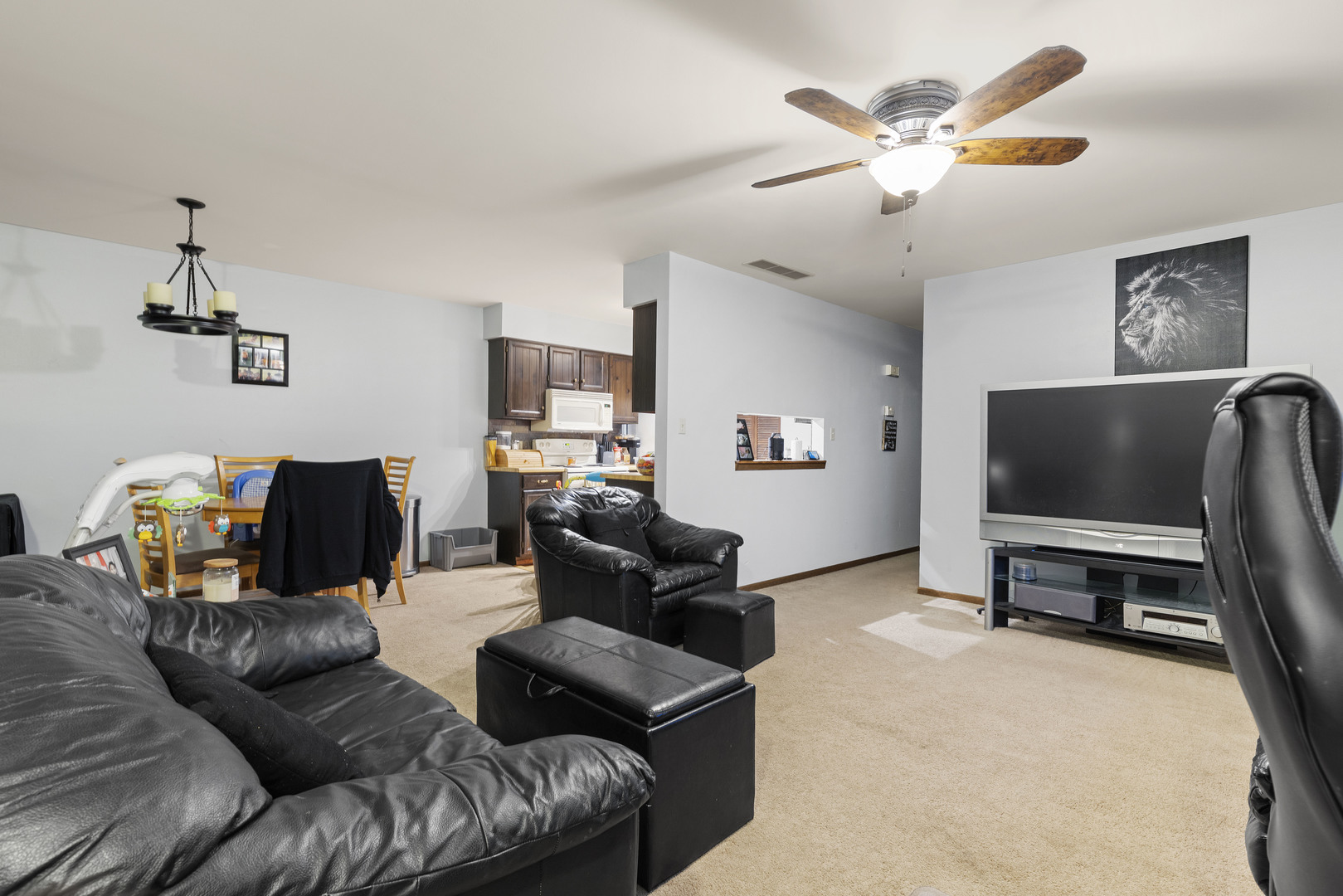 1723 Cedarbrook Court Sycamore, IL 60178 - Photo 7 of 11 a living room with furniture and a flat screen tv