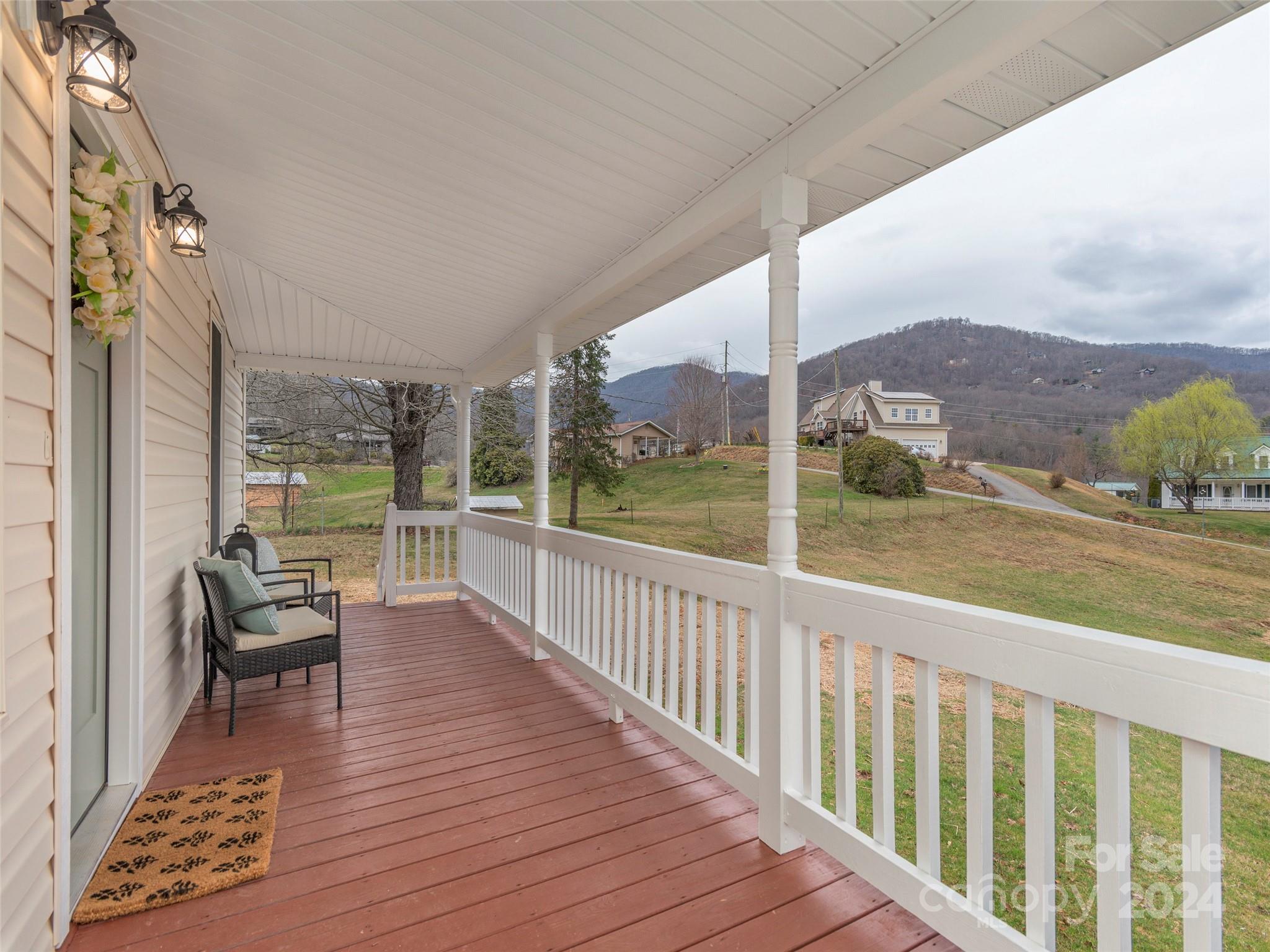 65 Squaw Ridge Road Waynesville, NC 28786 - Photo 2 of 24 a view of balcony with couch